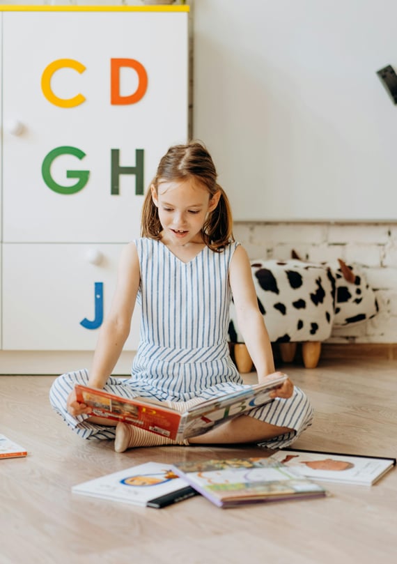 girl-reading-a-book-happily girl-reading-a-book-happily